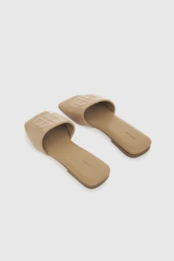 Anine Bing | Ria Slides - Butterscotch Monogram -Clothing Shop AB RIA SLIDES BUTTERSCOTCH MONOGRAMA 14 9100 270 3 1700x 49786488 369e 4cff b558 1f6ee7741f18